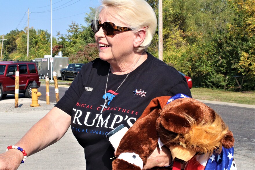 Marian Stevens shows her support for President Donald Trump at an Oct. 7 rally in Overland Park, Kansas, for U.S. Senate candidate Roger Marshall and other Republicans.