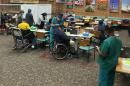 The Department of Veterans Affairs administers COVID-19 vaccines in a repurposed dining area at the Durham, North Carolina VA medical center.