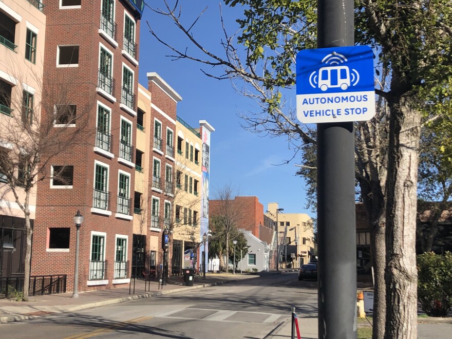 One of the automotive vehicle’s bus stops at the Southwest 2nd Street parking garage in downtown Gainesville. (Lauren Rousseau/WUFT News)