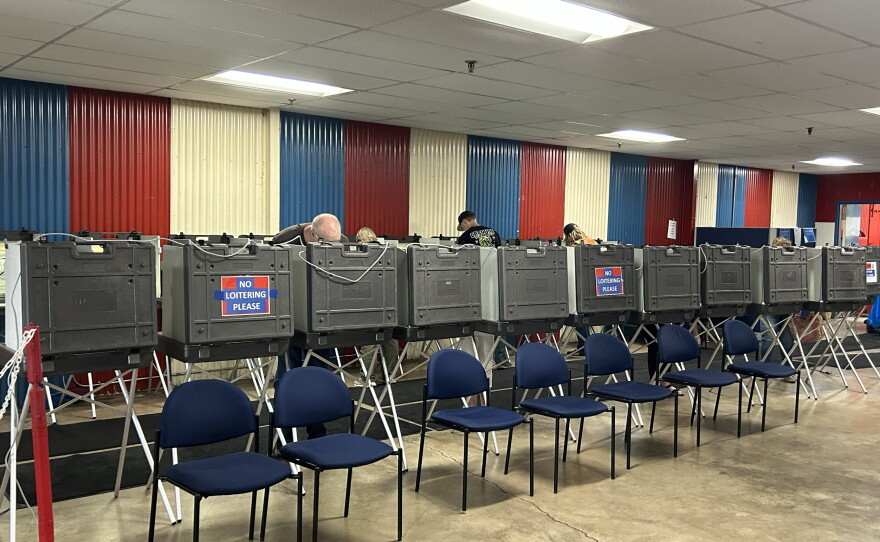Voters line up at booths to cast their ballots on Primary Election Day, Aug. 11, 2026, at the Chisholm Sports Arena complex.