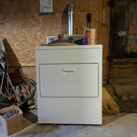 A washing machine in a basement