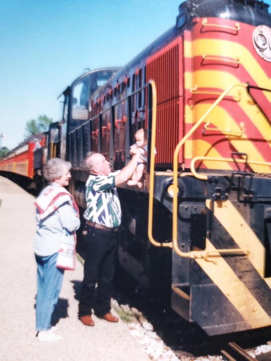 Carrol, “Andy,” Anderson with his wife Gloria and their grandson. Andy worked for the Port Terminal Railroad Association for decades and his family says he had a passion for trains.