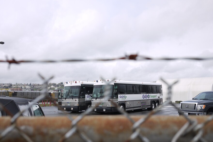 Buses used to trasport detainees at the Northwest Detention Center in Tacoma. The center is operated by the GEO Group, a private contractor.