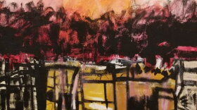Motif of reds, oranges, and yellows with black geometric shapes