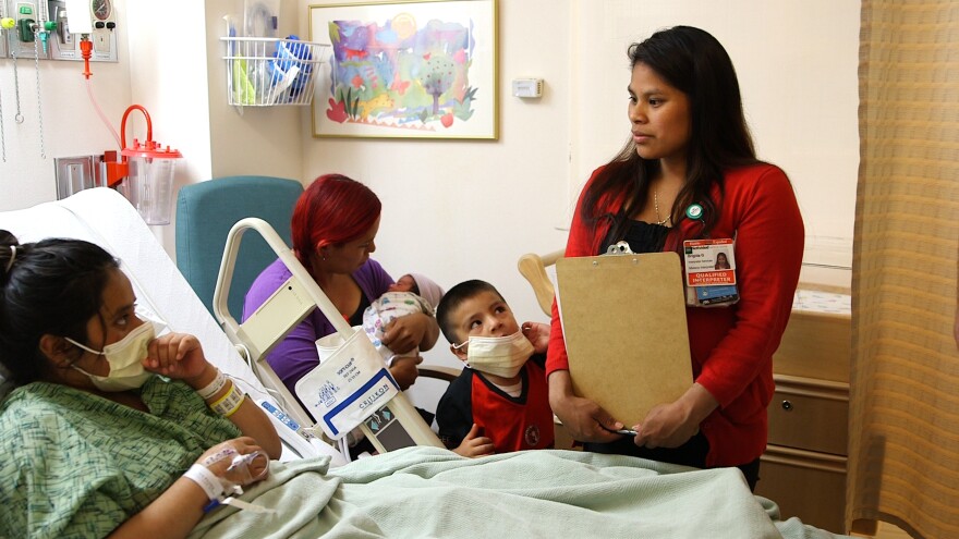Before becoming an interpreter at Natividad Medical Center in Salinas, Calif., Brigida Gonzalez (right) worked in the strawberry fields.