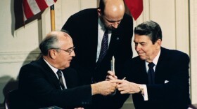 In this Dec. 8, 1987 file photo, President Ronald Reagan, right, and Soviet leader Mikhail Gorbachev exchange pens during the Intermediate Range Nuclear Forces Treaty signing ceremony in the White House. (Bob Daugherty/AP Photo)