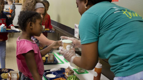 staff helping  a student 