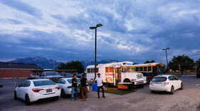 Venezuelan Jadiel Rodriguez greets people in front of his school bus turned store, catering to Venezuelan products Tuesday, July 14, 2026, in Midvale, Utah.