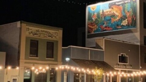 The Sawmill mural on the side of the new building in downtown Grayling.