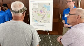 Residents discuss one of the concepts proposed by the state DOT at Thursday's public "scoping session."