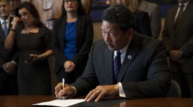 Seattle City Council President Bruce Harrell signs an executive order on Wednesday, September 13, 2017, after taking the oath of office and becoming the mayor of Seattle at City Hall.