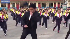 Video of a school in Shanxi province, China, shows principal Zhang Pengfei leading the students in a major update of the standard calisthenics routine.