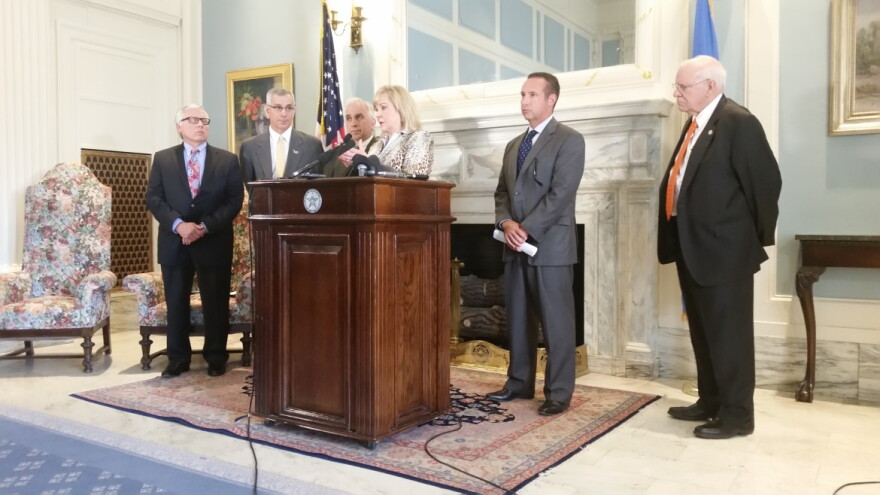 Gov. Mary Fallin, flanked by state officials, unveiled budget proposals Arpl 13, 2016.