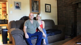 Mechanic Jimmy Arno and his wife, Dami, in their home near Atlanta. A photograph of Confederate Gen. Robert E. Lee hangs above them.