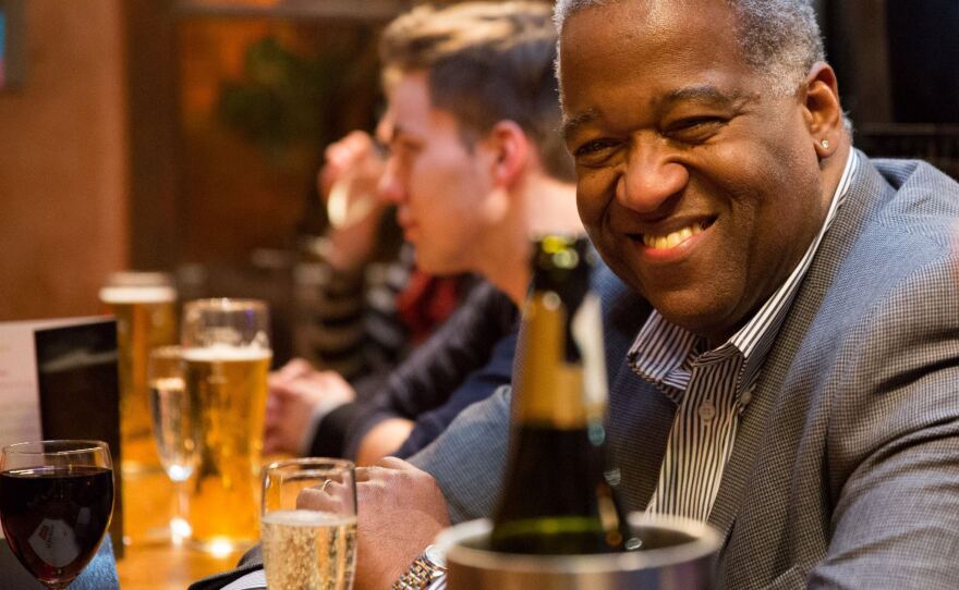 Panel moderator Collin Rustin enjoys a drink at the Closing Night party at Let's All Be Free Festival 2013.