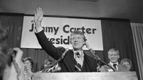 Then Georgia Gov. Jimmy Carter waves to a crowd gather in Atlanta on Thursday, Dec. 12, 1974 where he announced officially that is a Democratic candidate for the presidency. (AP Photo/BJ)