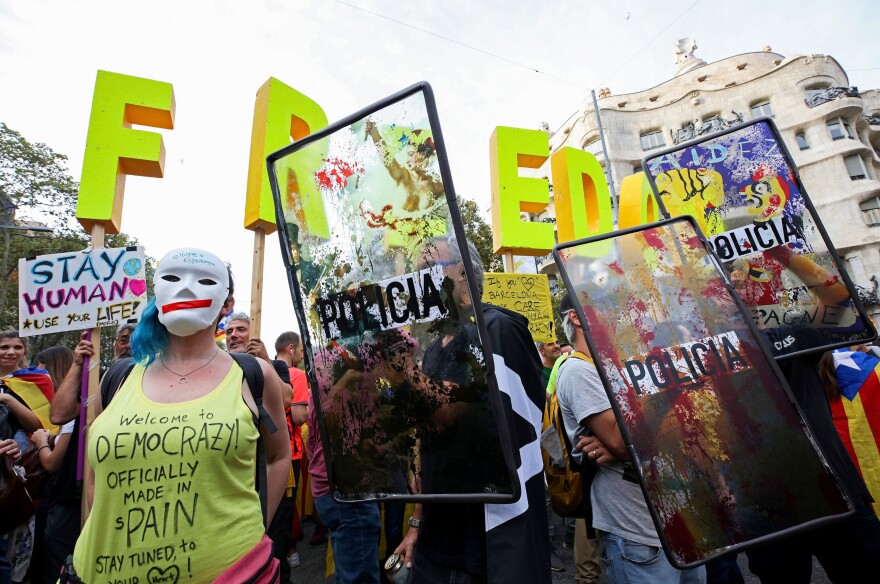 Young demonstrators gather following a week of protests on Friday in Barcelona, Spain.