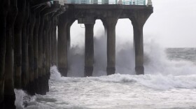 The Manhattan Beach pier is hit by high waves caused by the El Niño storm in Manhattan Beach, Calif., Wednesday, Jan. 6, 2016. 