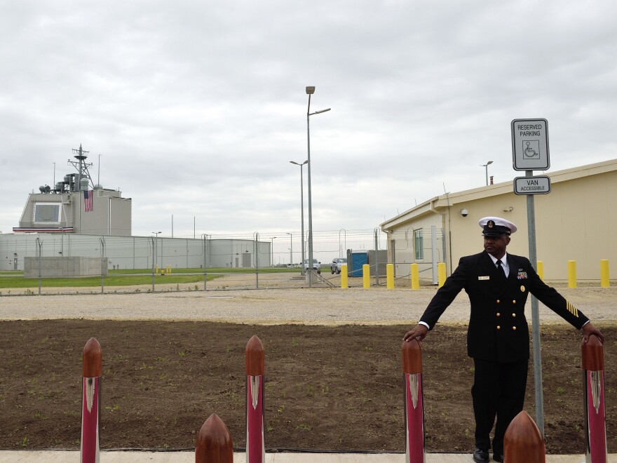 A U.S. Navy senior chief petty officer stands watch ahead of a ceremony inaugurating the U.S. anti-missile station Aegis Ashore Romania at Deveselu, Romania, in 2016. The station is part of NATO's anti-missile shield for Europe.