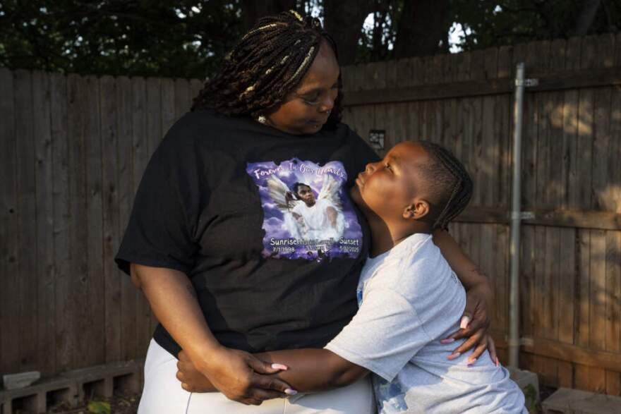 Cicely Mason hugs her grandson Mario Mason Jr. at her home in Oklahoma City, Oklahoma on Wednesday August 20, 2025. (Nick Oxford for Here & Now)