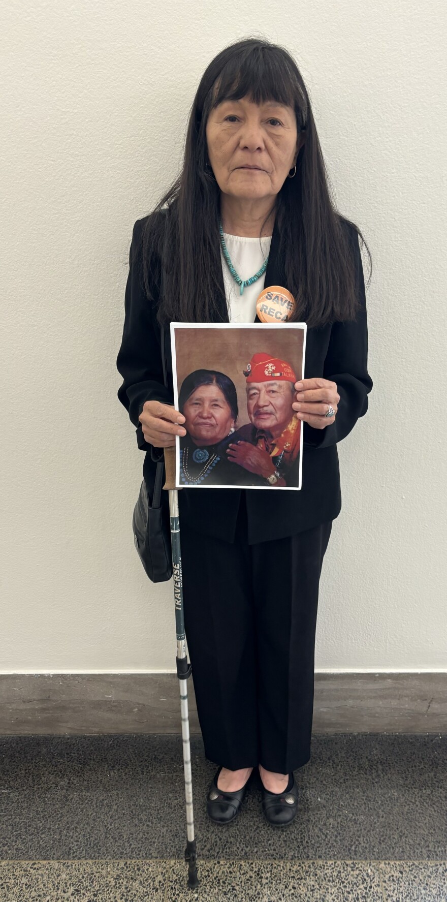 Maggie Billiman holds a picture of her late parents, Mary Louis and Howard Billiman. She believes her father died of cancer related to his exposure to nuclear fallout.