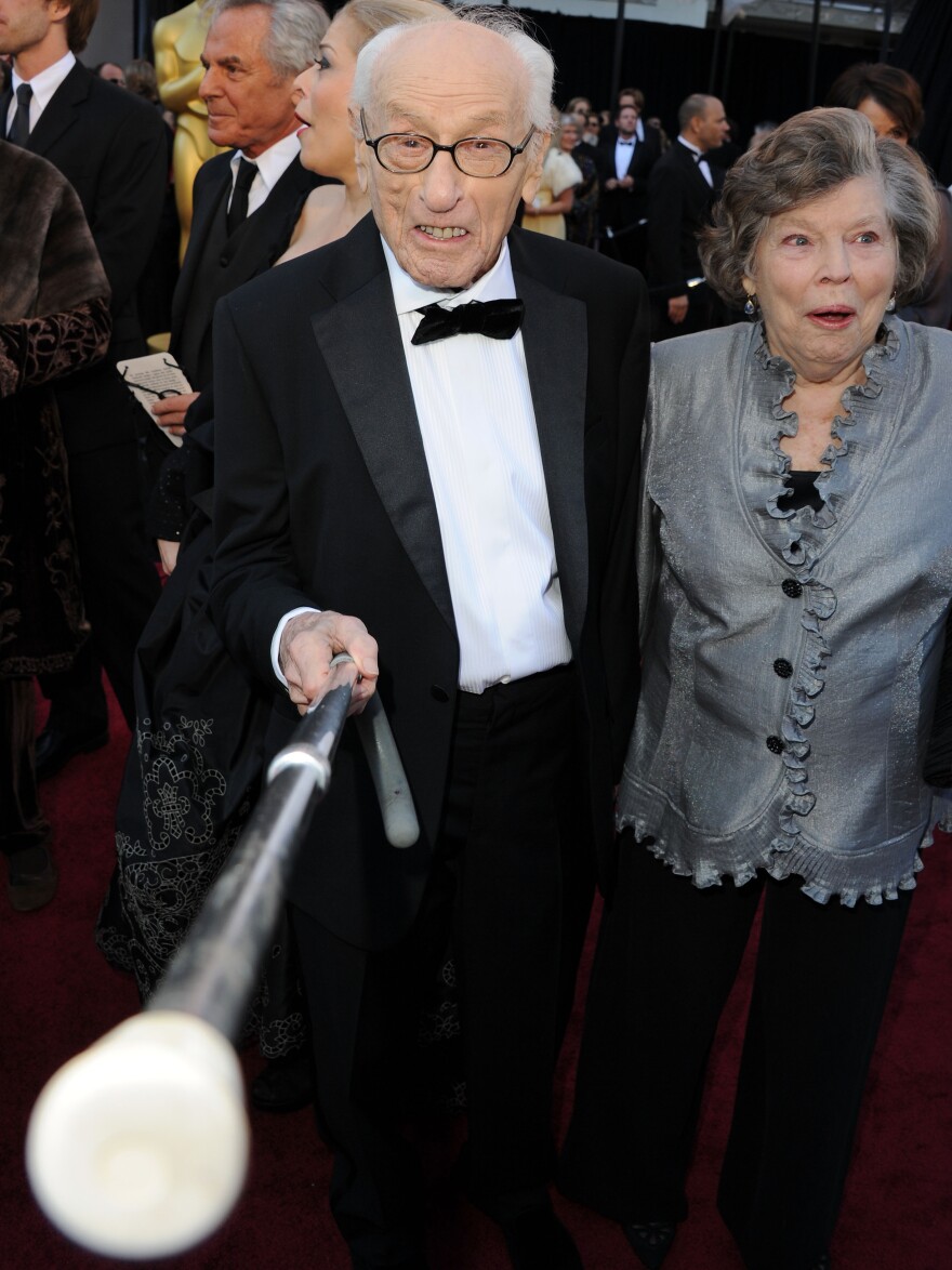 Eli Wallach arrives at the 2011 Academy Awards with his wife, Anne Jackson. Wallach died Tuesday.