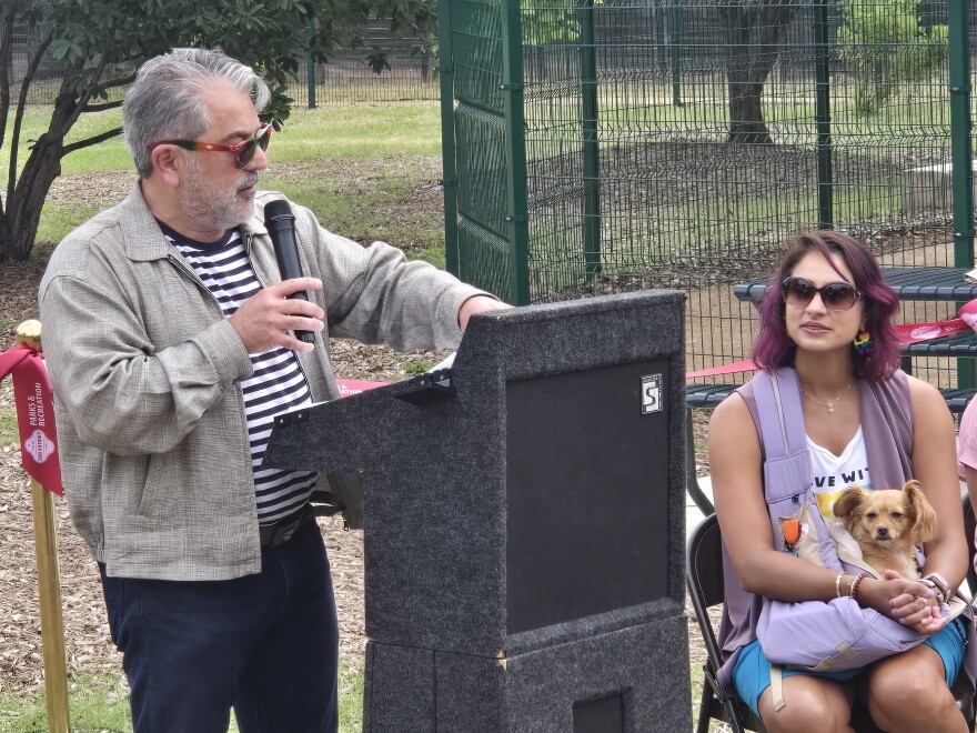 San Antonio Parks and Recreation Director Homer Garcia III welcomes residents and dignitaries to opening of city's 21st dog park in June in Beacon Hill.  District 1 Councilwoman Sukh Kaur looks on with her dog, Hera