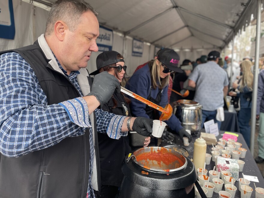 The crew from Pepperjack’s Cafe serves up samples of its winning creamy tomato soup and grilled cheese at Soupsköl on Jan. 14, 2023. 