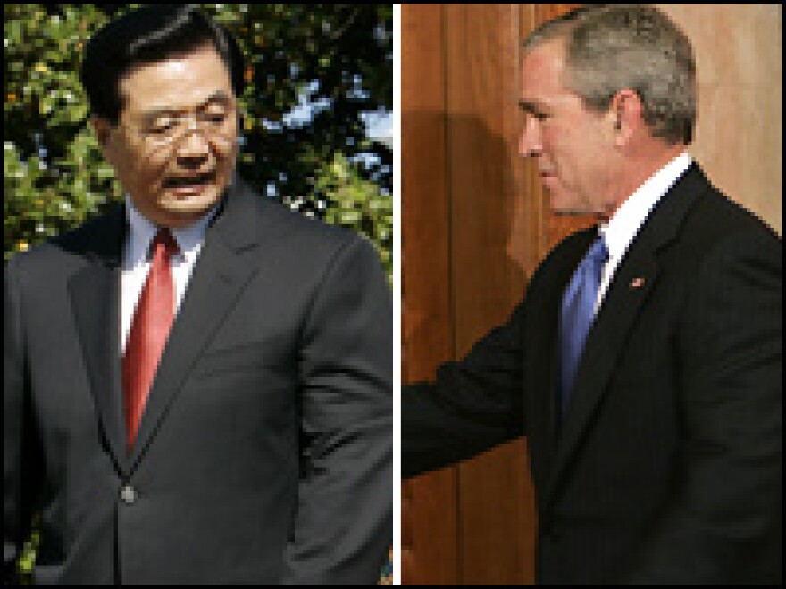 Not So Fast: Exit strategies are hard to come by for American and Chinese presidents. Thursday, President Hu headed for the wrong side of the podium (left). And in November, President Bush approached a locked door during a visit to China.