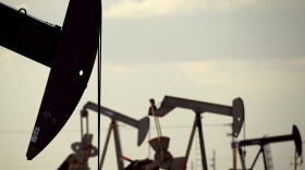 In this April 24, 2015 file photo, pump jacks work in a field near Lovington, N.M. (Charlie Riedel, File/AP)
