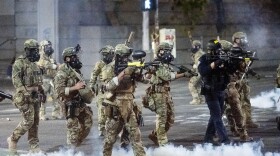 Federal agents use crowd control munitions to disperse Black Lives Matter protesters at the Mark O. Hatfield United States Courthouse in Portland, Oregon. (Noah Berger/AP)
