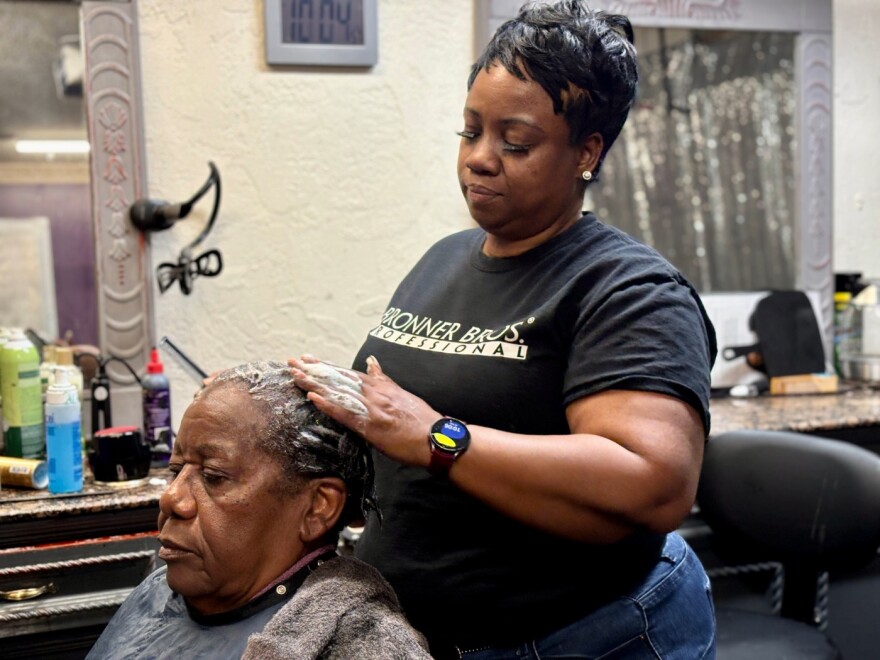 Rhonda Calahan, a Sarasota hair stylist and survivor of domestic violence, works on client Shirley Shaw at her salon on a sunny morning in mid-October. Calahan also runs Queens of Domestic Violence and Awareness, a nonprofit that helps abuse survivors find safety and support.