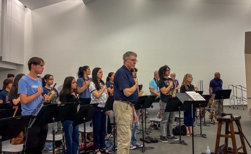 Even during rehearsal, the band held their hands over the hearts for the U.S. national anthem.