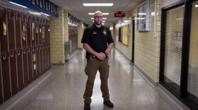 School resource officer, John Pence poses at Sidney High School in Ohio in 2019. School districts around the country are ending or reexamining their contracts with local police departments in the wake of George's Floyd's killing. 