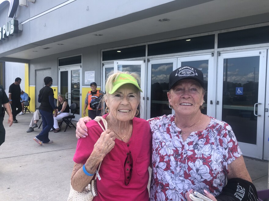 Jacquelyn Keys (left) and Sue Stillwell (right) standing in front of the Hertz Arena in Estero.