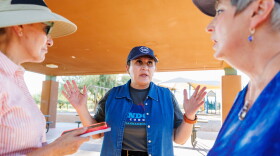 JoAnna Mendoza (D), an Arizona Congressional District 6 candidate, center, talks with campaign volunteers before a weekly neighborhood canvass, Thursday, Oct. 15, 2026, in Oro Valley, Ariz. (AP Photo/Mike Christy)