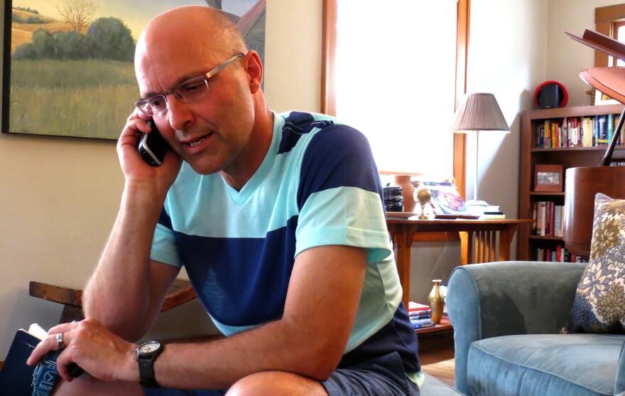 Brian Mathers calls his husband, Isidro, in Mexico from his living room in Sioux City, Iowa. Brian and Isidro have been separated for more than a year by immigration laws that did not recognize their marriage.