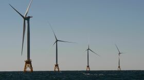 Wind turbines, of the Block Island Wind Farm, tower over the water on October 14, 2016 off the shores of Block Island, Rhode Island.