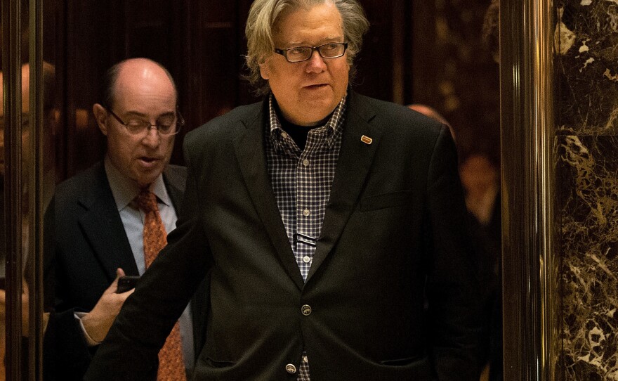 Steve Bannon exits an elevator in the lobby of Trump Tower on Friday. He has been newly named the chief strategist of the Trump White House.