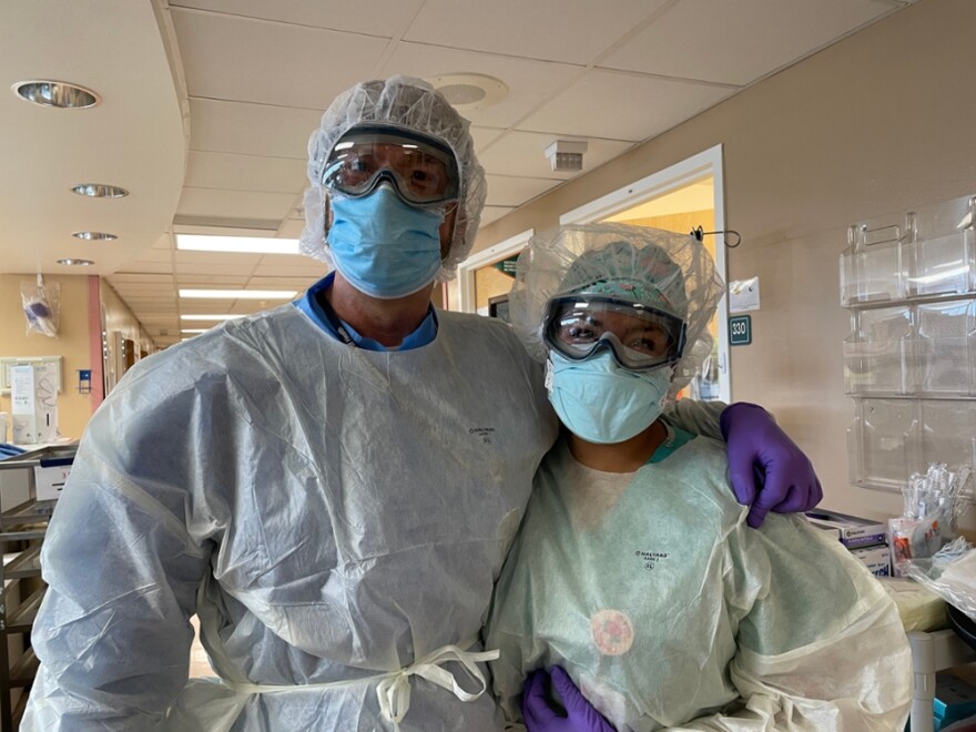 Director of the University of New Mexico's Center for Global Health DJ Perkins stands next to a nurse at the hospital. Perkins, along with the study's lead author, Ivy Hurwitz, would go into each of the patients' rooms and ask if they wanted to participate in their observational study.