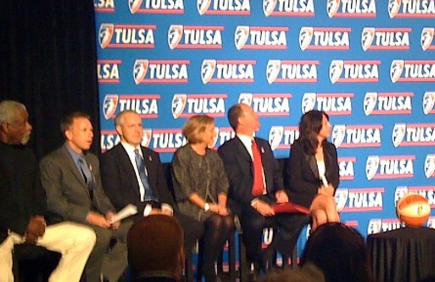 Dignitaries sit on the platform at the Mayo Hotel as the announcement is made that the WNBA is coming to Tulsa.