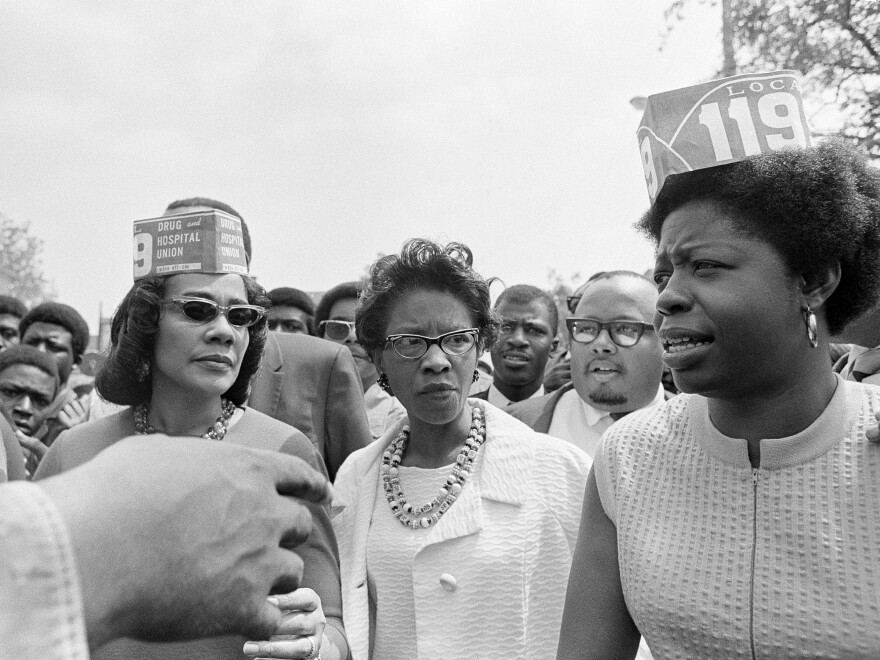 From left to right: Coretta Scott King, widow of Dr. Martin Luther King, Juanita Abernathy, and Mary Moultrie, a nurse's aide during a march in support of the 100-day strike in Charleston, S.C. in 1969.