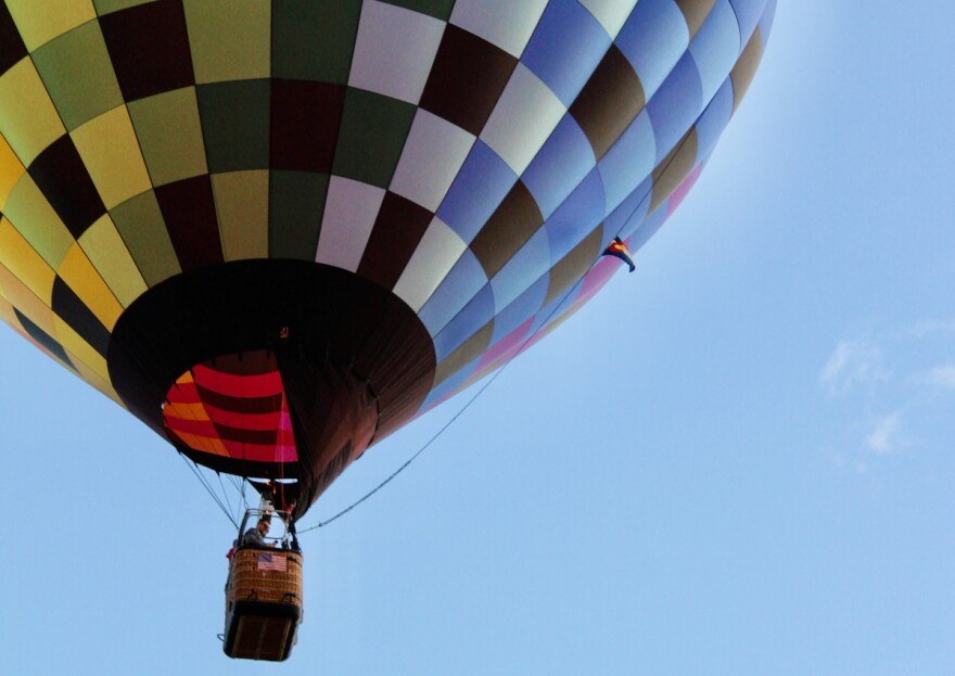 A hot air balloon called “Finish Line” floats above Snowmass Town Park during the Snowmass Balloon Festival on Friday, Sept. 16, 2022. Balloons filled with hot air on each morning of the three-day festival but did not fly high on Saturday due to inclement weather.