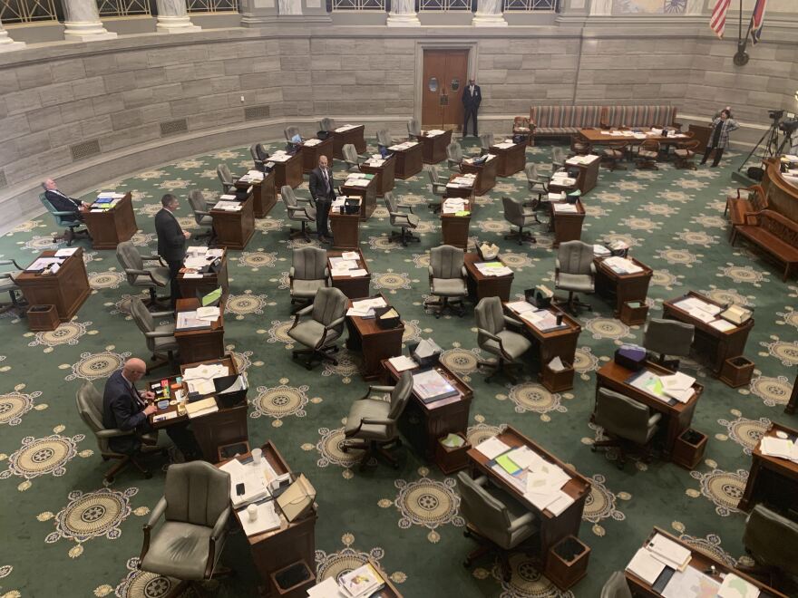 A nearly empty Missouri Senate during a filibuster. Sen Bill Eigel, R-Weldon Spring, speaks with Sen. Rick Brattin, R-Harrisonville.