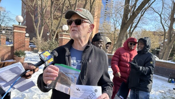 Abe Lyba, a tenant at Hanover Square Apartments, speaks to the media.