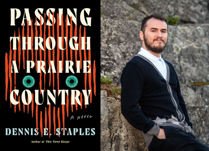 Book cover for "Passing Through a Prairie Country" by Dennis E. Staples. A skull-like shape with bright blue-green neon eyes is on the cover. To the right, a photograph  of the author, Dennis E. Staples. leans against a rocky wall.