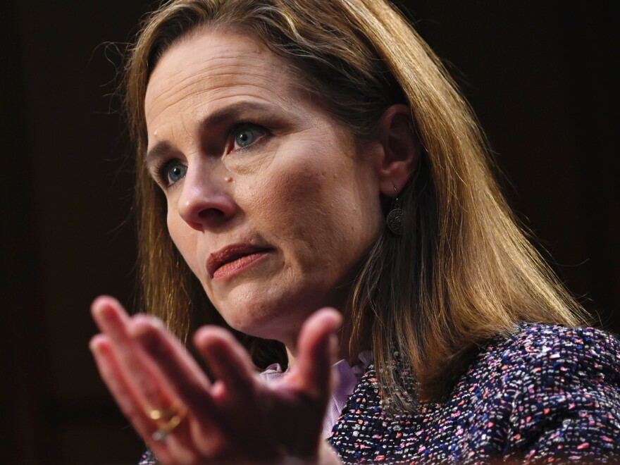 Amy Coney Barrett testifies during her confirmation hearings last month. The new justice heard her first arguments Monday as a member of the U.S. Supreme Court.