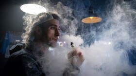 A man exhales vapor produced by an e-cigarette in Bristol, England. (Matt Cardy/Getty Images)