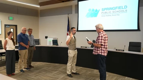 New board member Matthew Brandt is sworn in by board chair Jonathan Light on Monday, July 28, 2026.