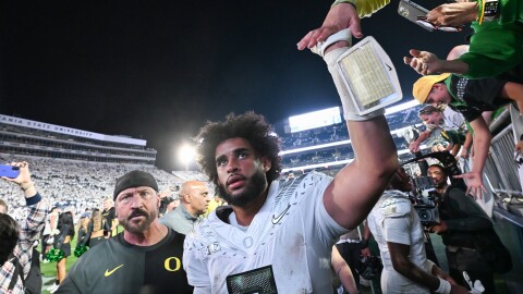Oregon quarterback Dante Moore (5) celebrates a second overtime win over Penn State during their NCAA college football game, Saturday, Sept. 27, 2025, in State College, Pa.